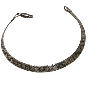 Reversible diamond-cut herringbone bracelet with a Greek key design bracelet